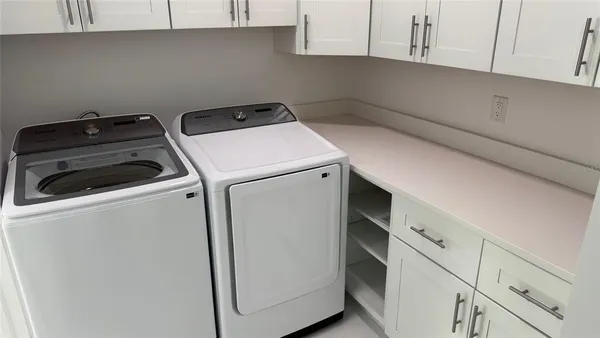 a utility room with dryer and washer