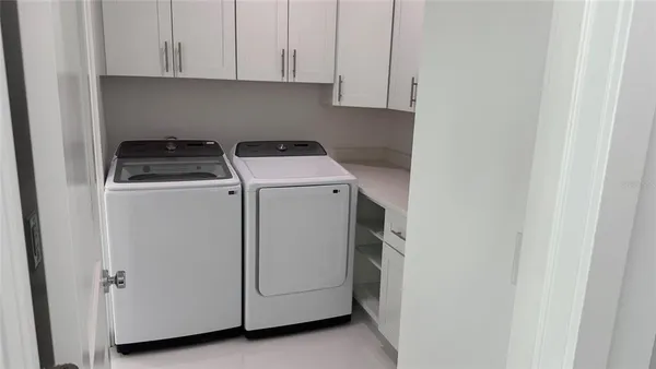 a utility room with dryer and washer