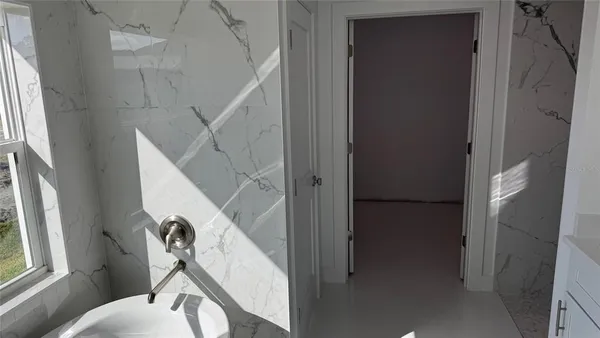 a view of entryway and hall with wooden floor