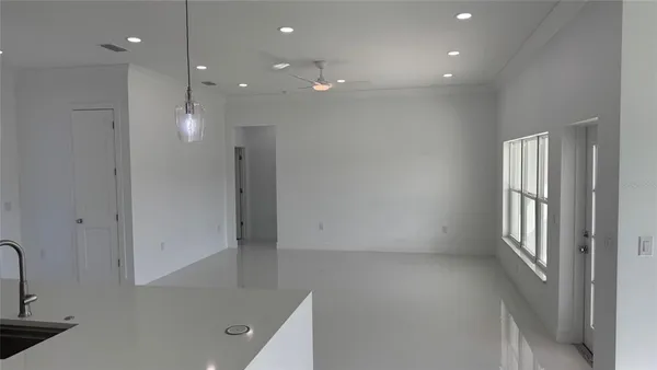 a kitchen that has a sink and a stove in it