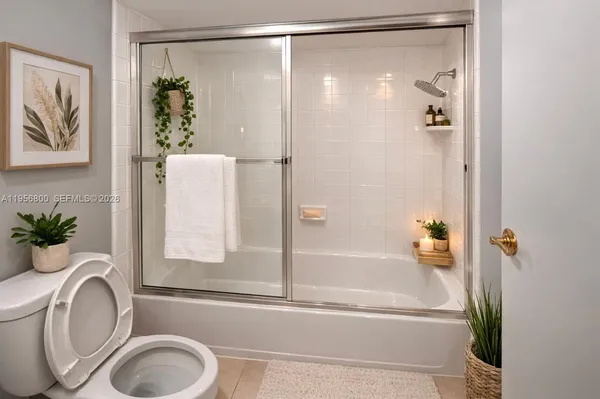 a bathroom with a tub and a shower