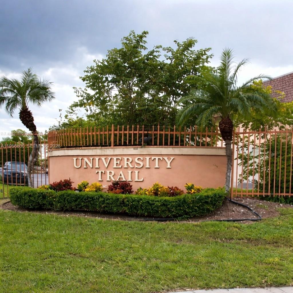 850 Southwest 129th Place, Unit 103 Miami, FL 33184 - Photo 6 of 8 a sign on the side of the building