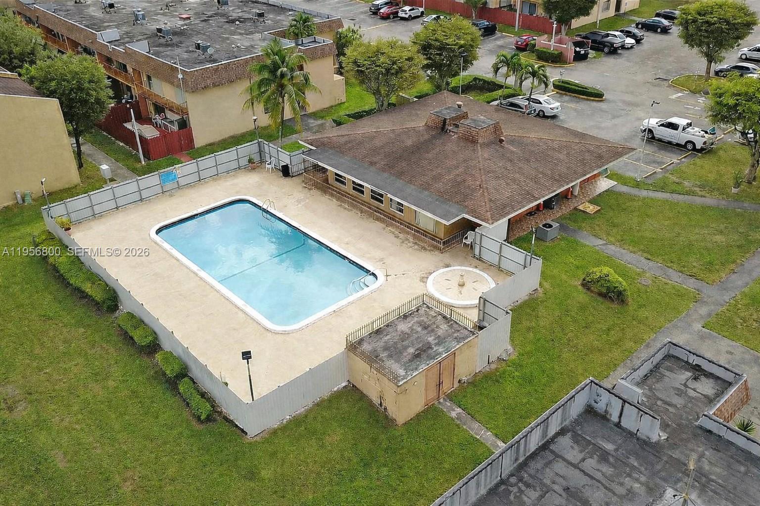 850 Southwest 129th Place, Unit 103 Miami, FL 33184 - Photo 8 of 8 an aerial view of a house having yard