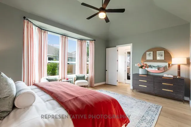 a bedroom with a bed and a dresser