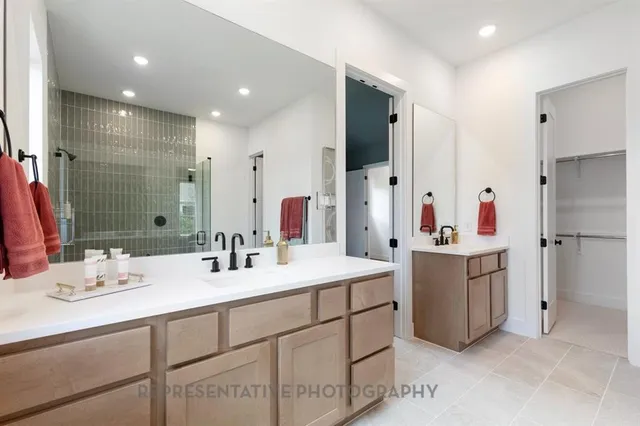 a bathroom with a sink double vanity and a mirror