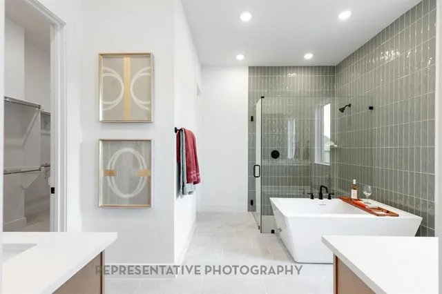 a bathroom with a sink a tub and a mirror