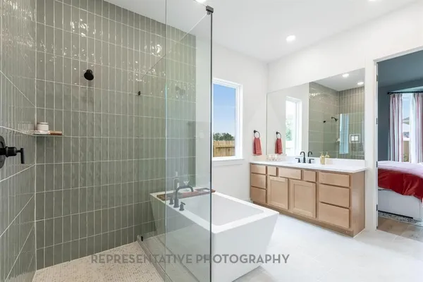 a bathroom with a tub sink and mirror