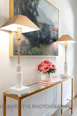 a view of a table and chair under an umbrella