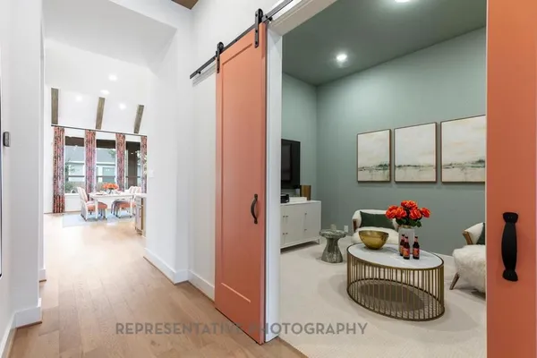 a bathroom with a sink mirror and vanity