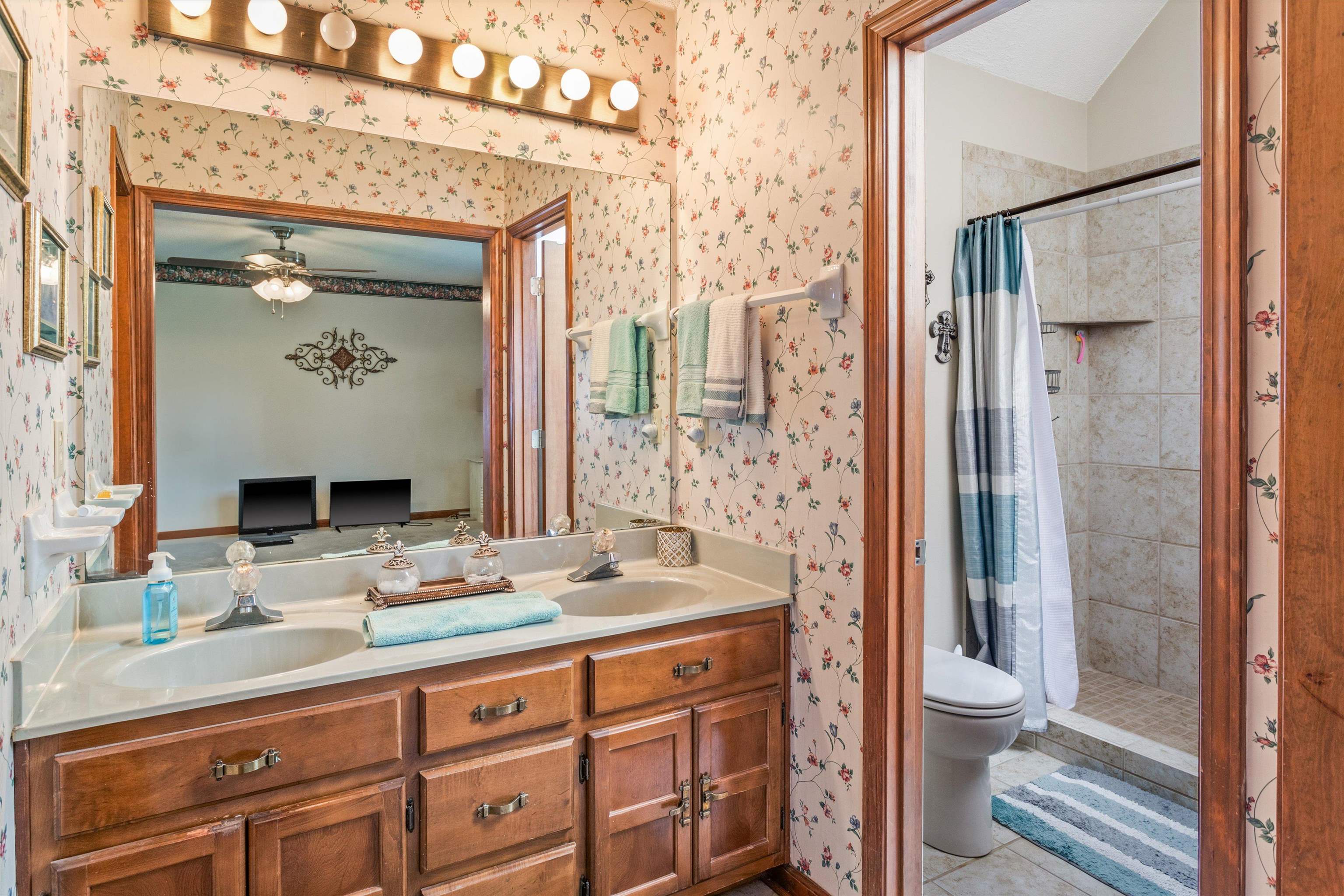 509 Shelton Road Collierville, TN 38017 - Photo 13 of 21 a bathroom with a granite countertop sink and a mirror