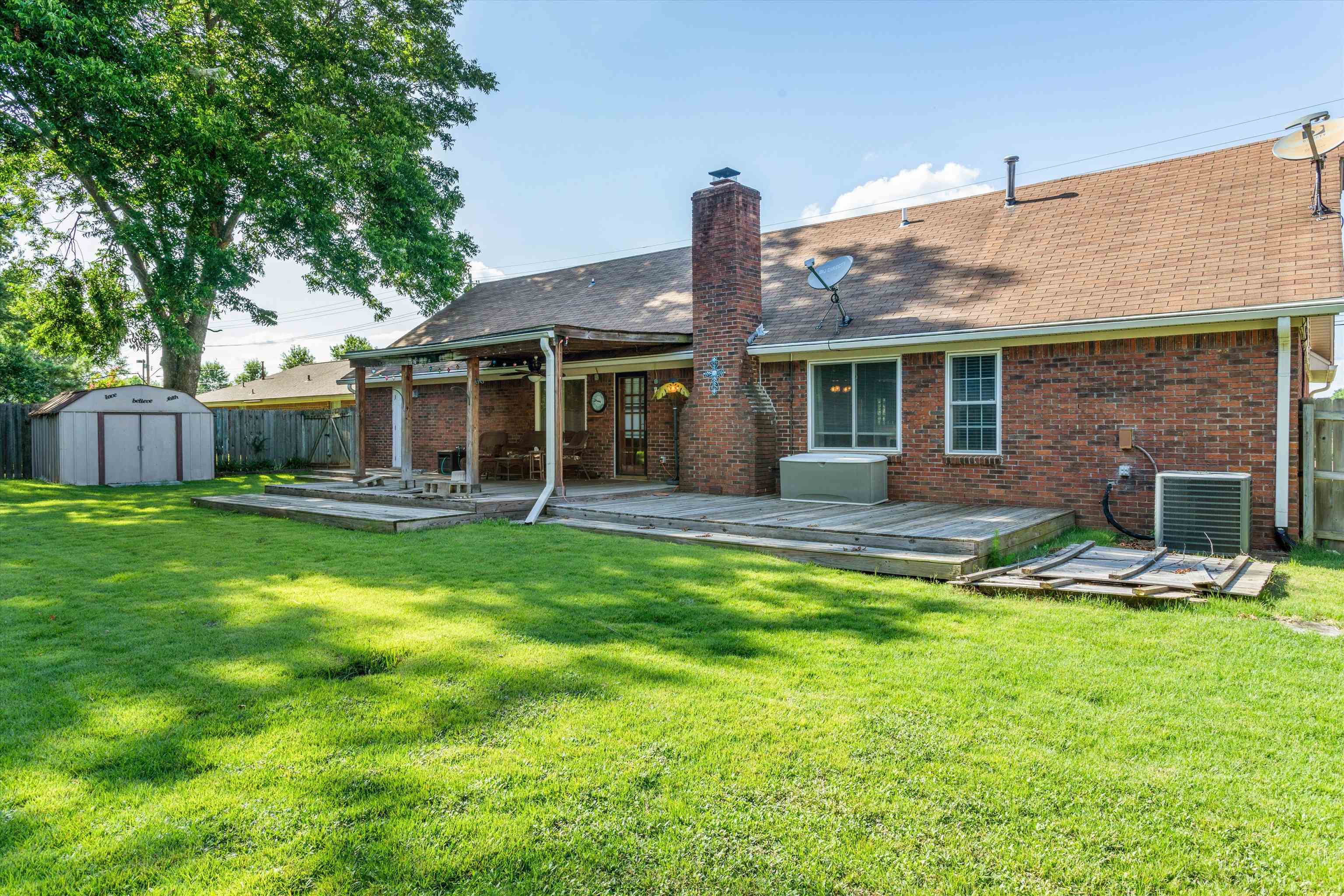 509 Shelton Road Collierville, TN 38017 - Photo 21 of 21 a front view of a house with a yard and green space