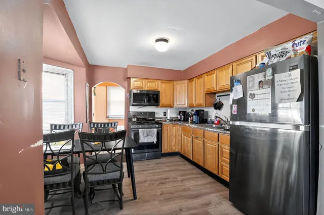 a view of a dining room with furniture and window