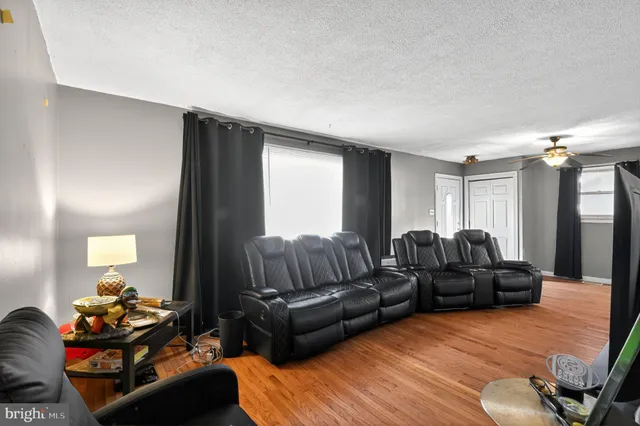 a living room with furniture window and a couch