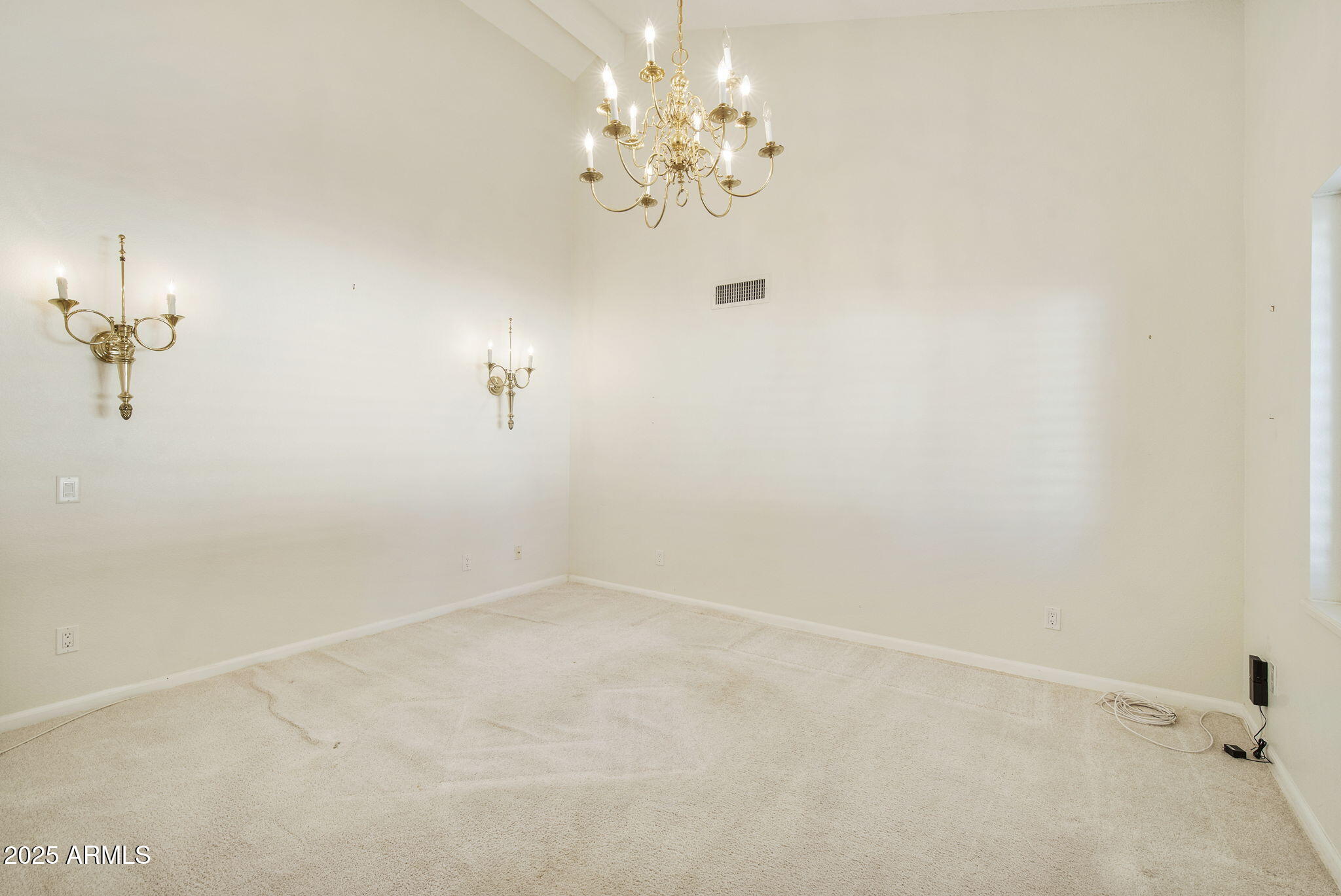 7365 East Valley View Road Scottsdale, AZ 85250 - Photo 15 of 45 a view of a chandelier fan and fire place