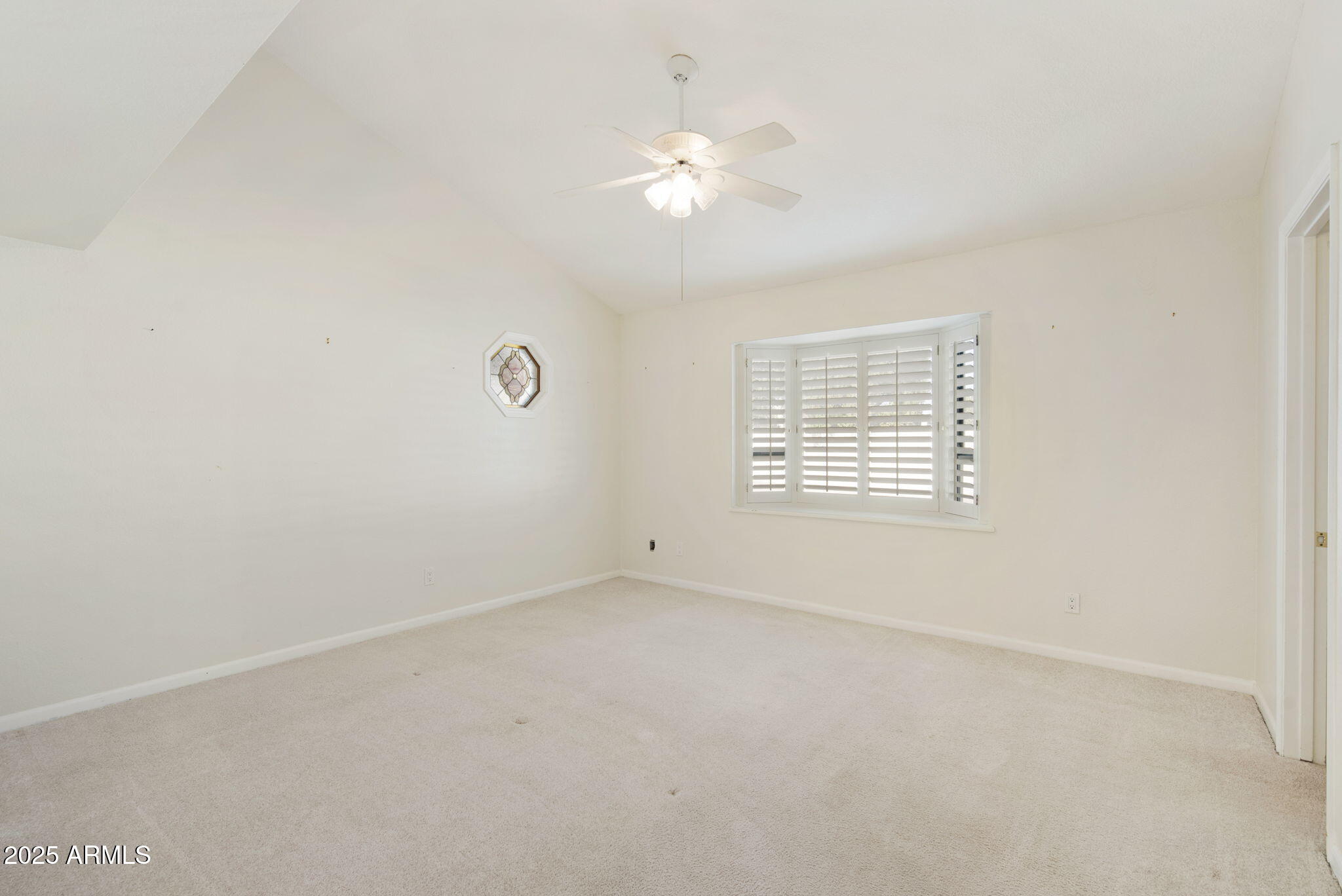 7365 East Valley View Road Scottsdale, AZ 85250 - Photo 17 of 45 a view of an empty room with a window