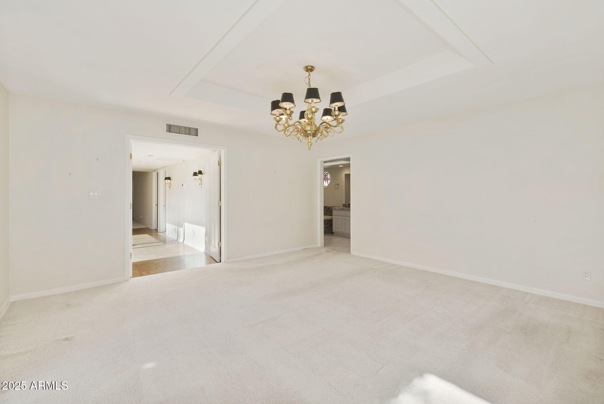 7365 East Valley View Road Scottsdale, AZ 85250 - Photo 21 of 45 a view of a chandelier fan and refrigerator
