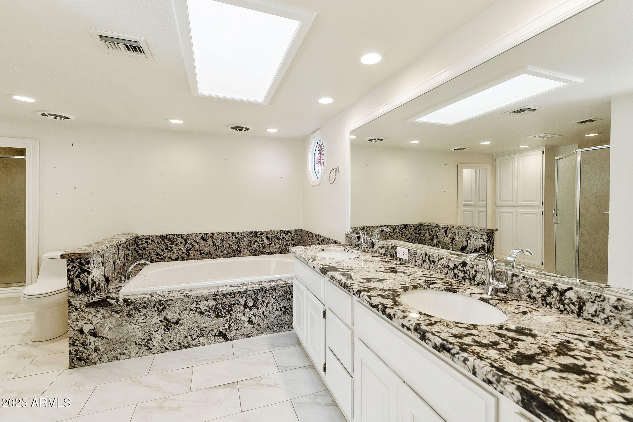 7365 East Valley View Road Scottsdale, AZ 85250 - Photo 22 of 45 a bathroom with a double vanity sink mirror and shower