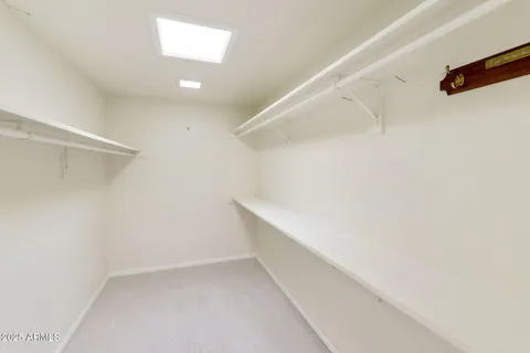 a bathroom with a mirror sink and shower