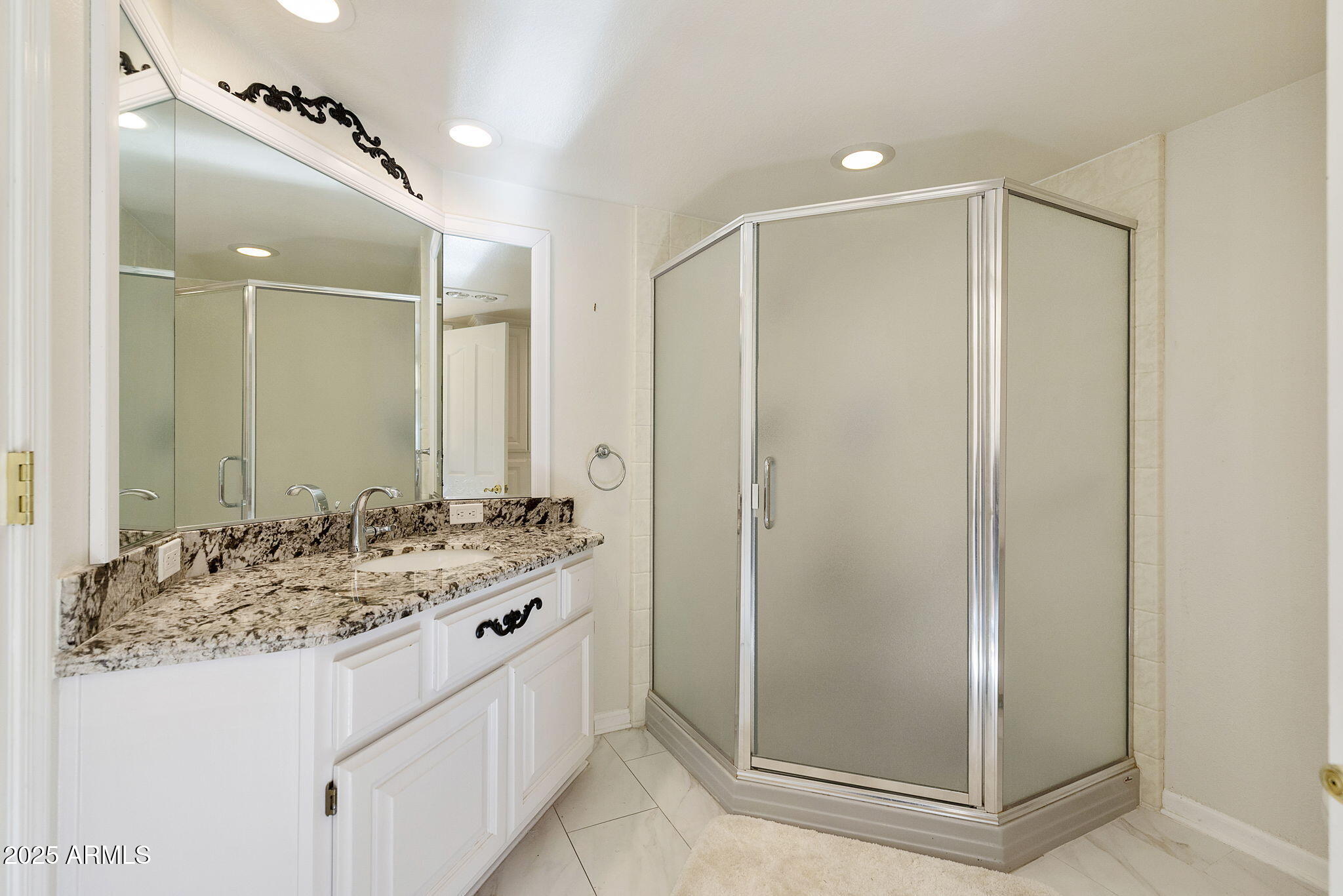 7365 East Valley View Road Scottsdale, AZ 85250 - Photo 26 of 45 a bathroom with a mirror sink and shower