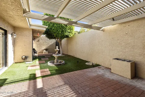 a view of a porch with a floor to ceiling window and wooden floor