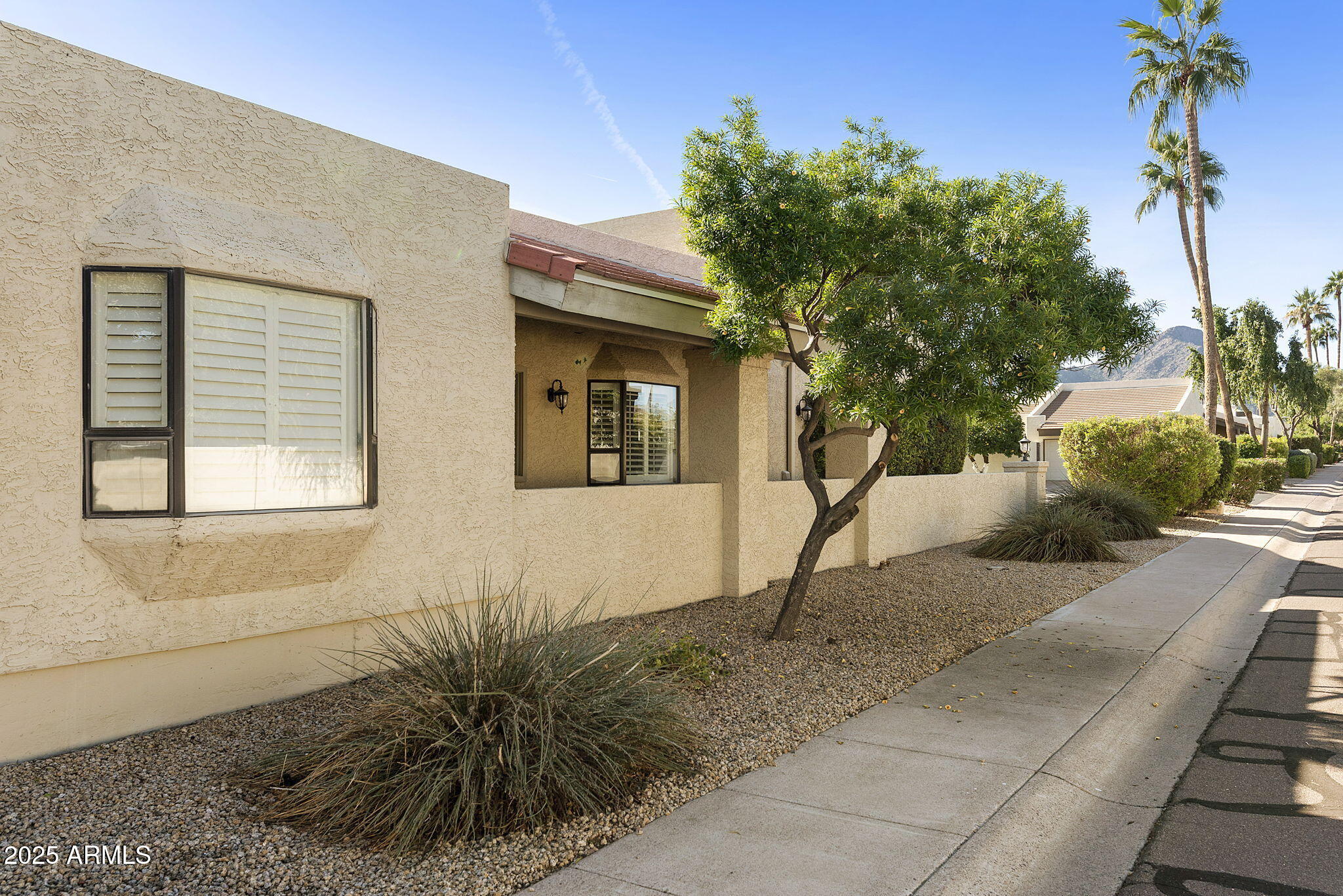 7365 East Valley View Road Scottsdale, AZ 85250 - Photo 40 of 45 a view of a house with a yard