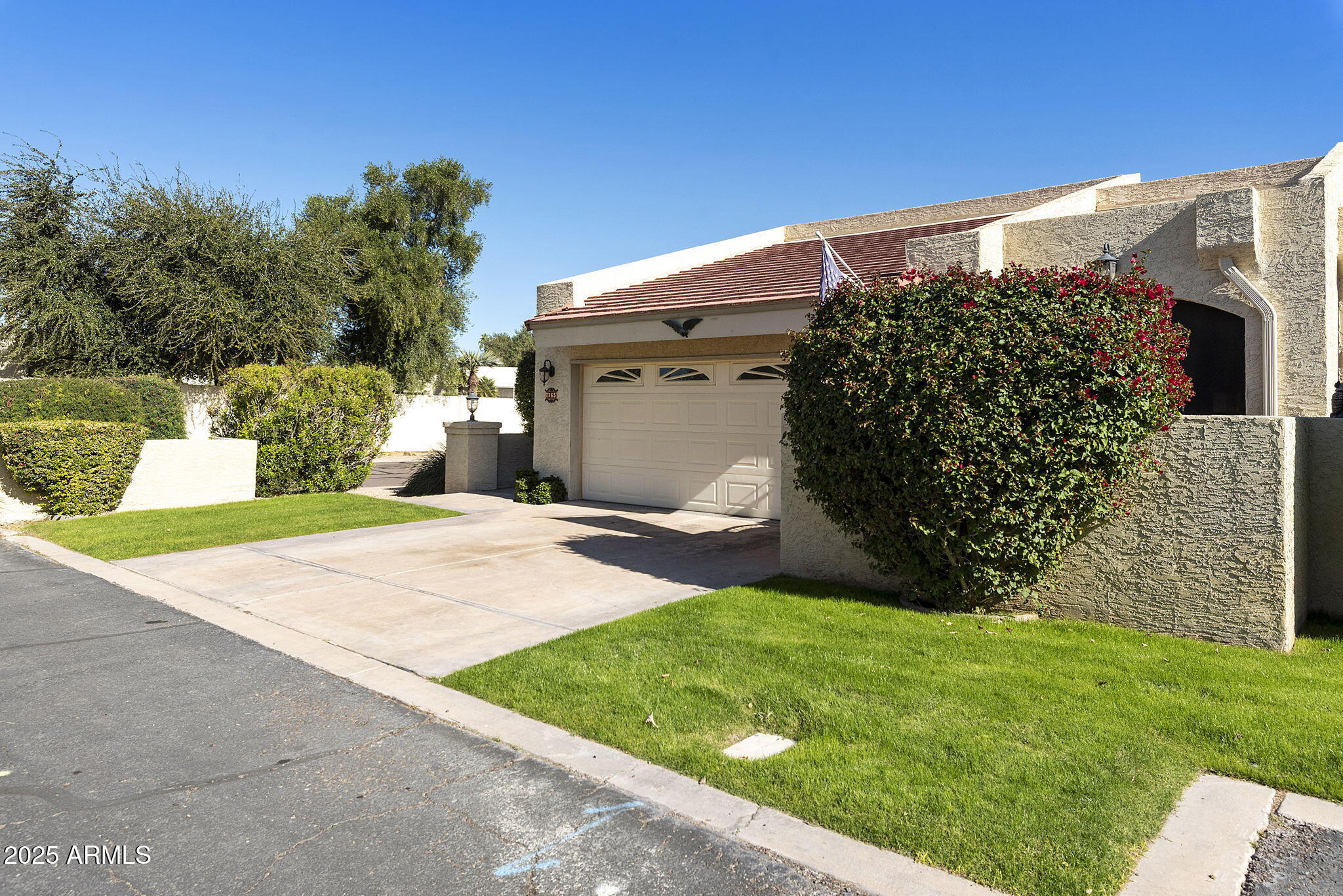 7365 East Valley View Road Scottsdale, AZ 85250 - Photo 41 of 45 a front view of a house with garden