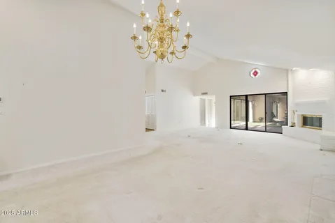 a bathroom with a granite countertop sink a mirror and shower