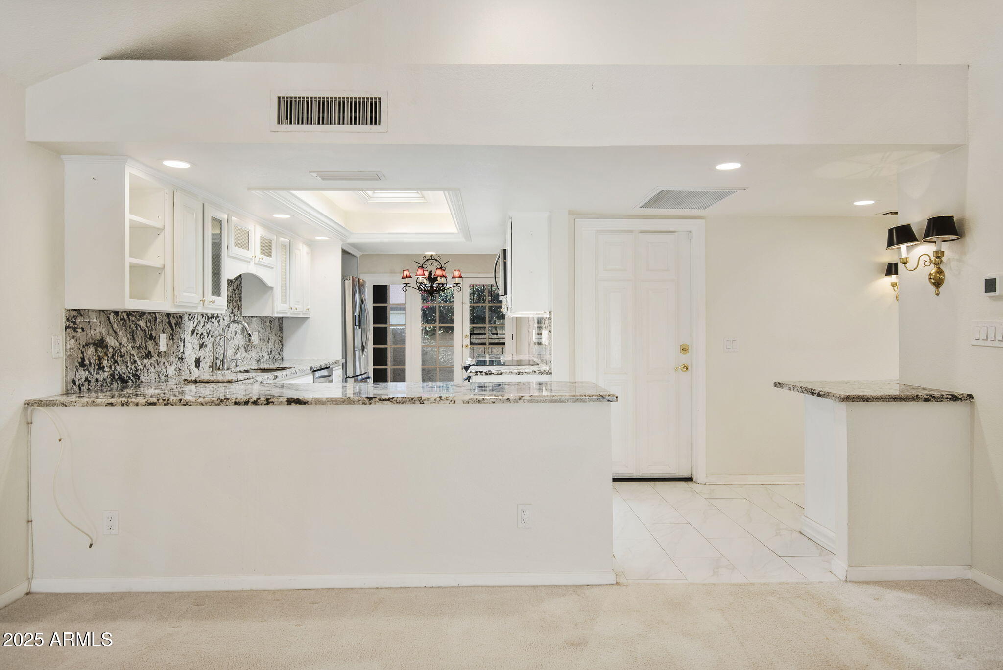 7365 East Valley View Road Scottsdale, AZ 85250 - Photo 6 of 45 a bathroom with a granite countertop sink a mirror and shower