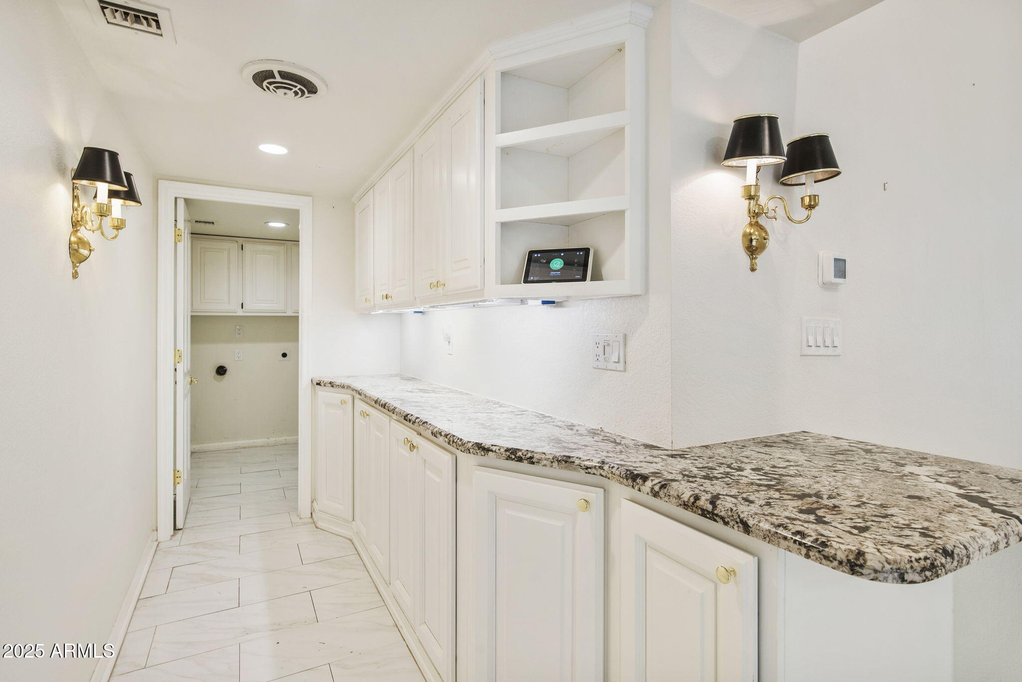 7365 East Valley View Road Scottsdale, AZ 85250 - Photo 8 of 45 a bathroom with a granite countertop sink and a mirror