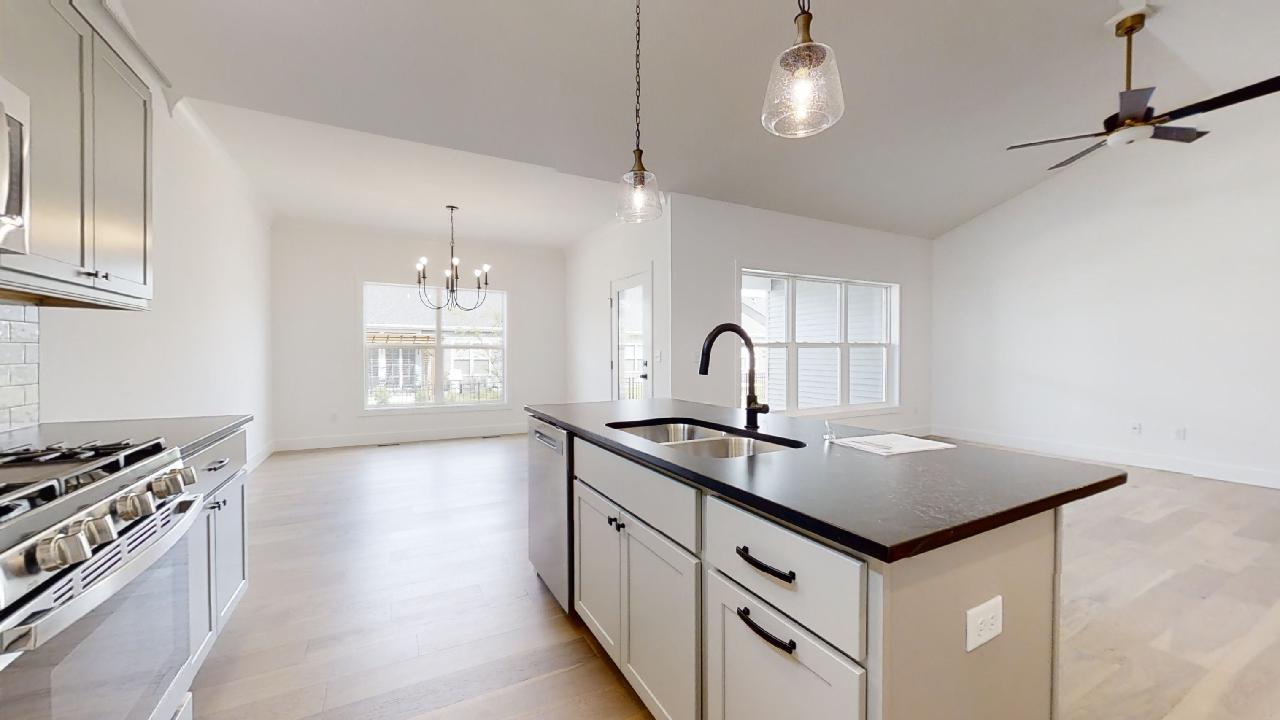 3910 Bay Circle Champaign, IL 61822 - Photo 12 of 49 a kitchen with stainless steel appliances a sink stove and cabinets