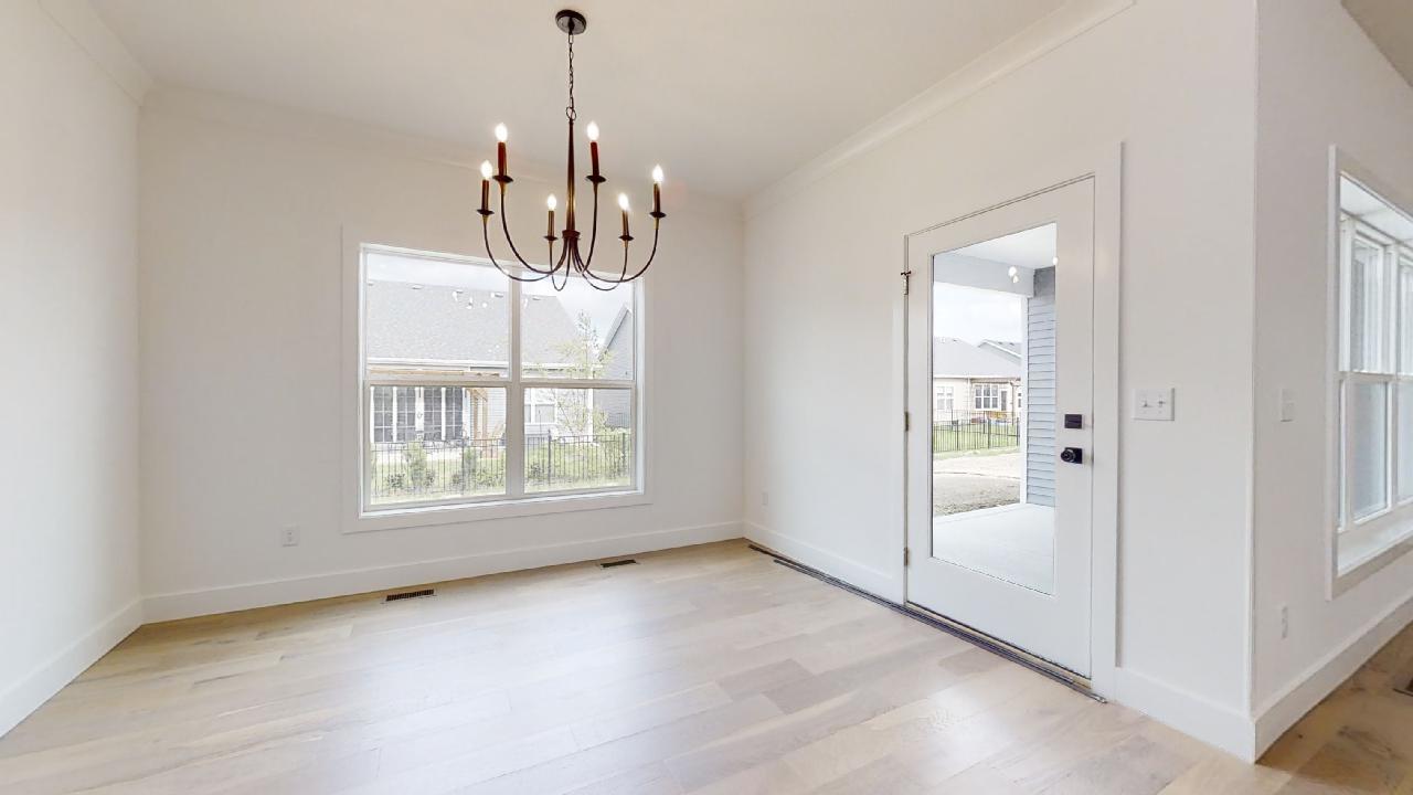 3910 Bay Circle Champaign, IL 61822 - Photo 13 of 49 a view of a room with window and chandelier