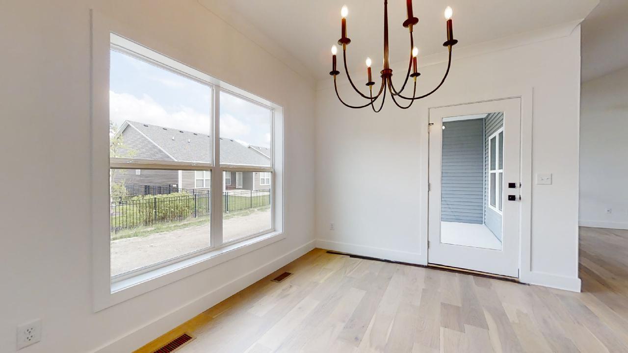 3910 Bay Circle Champaign, IL 61822 - Photo 14 of 49 a view of a livingroom with wooden floor and window