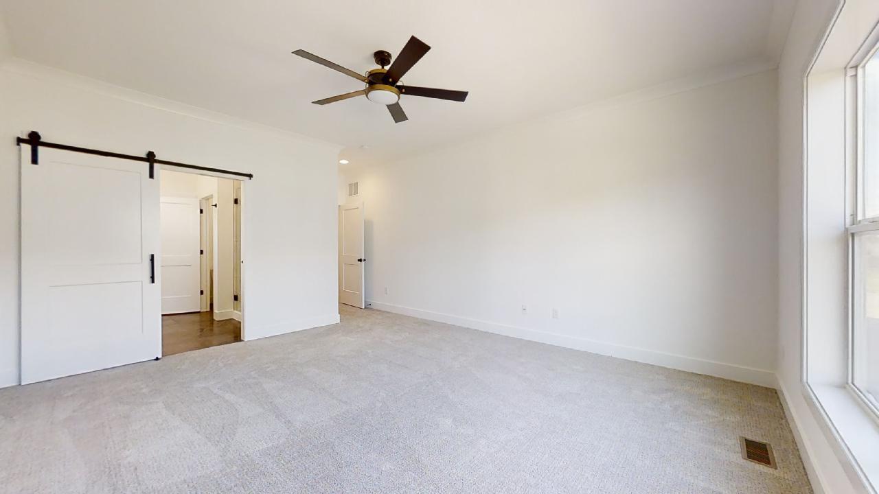 3910 Bay Circle Champaign, IL 61822 - Photo 18 of 49 a view of a big room with a ceiling fan and a window