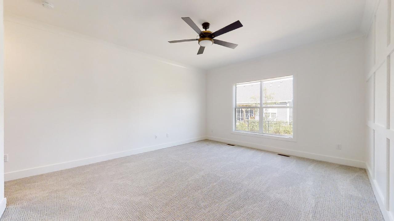 3910 Bay Circle Champaign, IL 61822 - Photo 19 of 49 an empty room with a ceiling fan and window