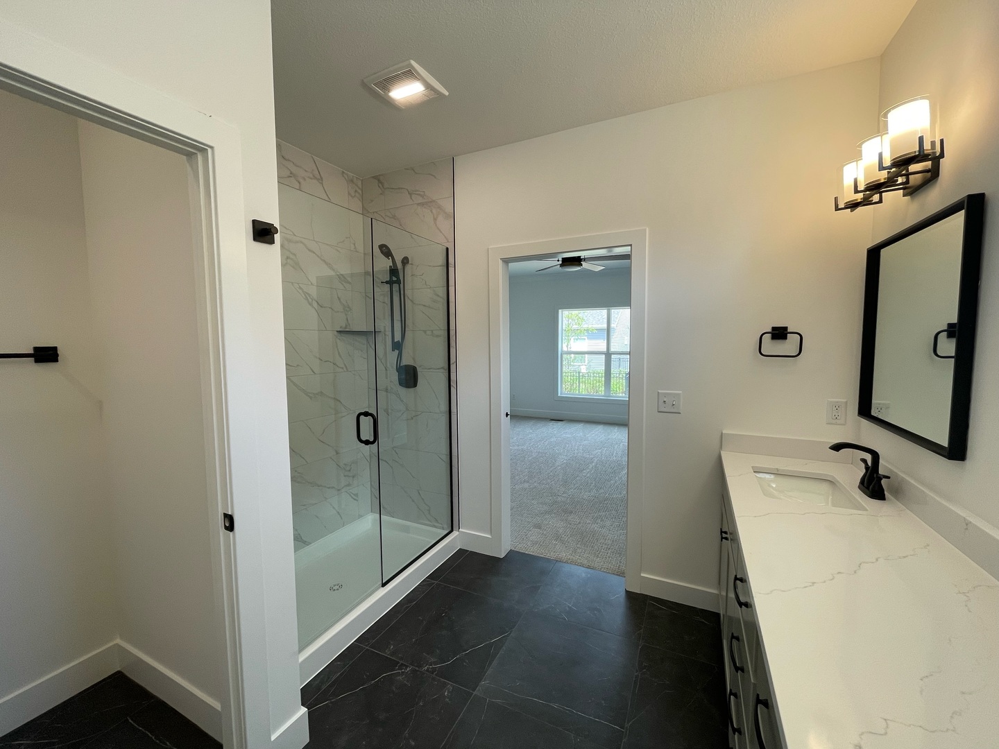 3910 Bay Circle Champaign, IL 61822 - Photo 21 of 49 a bathroom with a sink a light fixture and a mirror