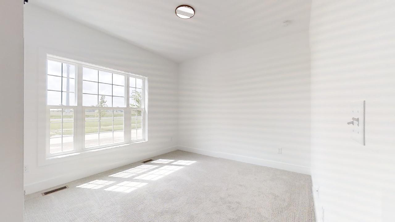 3910 Bay Circle Champaign, IL 61822 - Photo 22 of 49 an empty room with a window