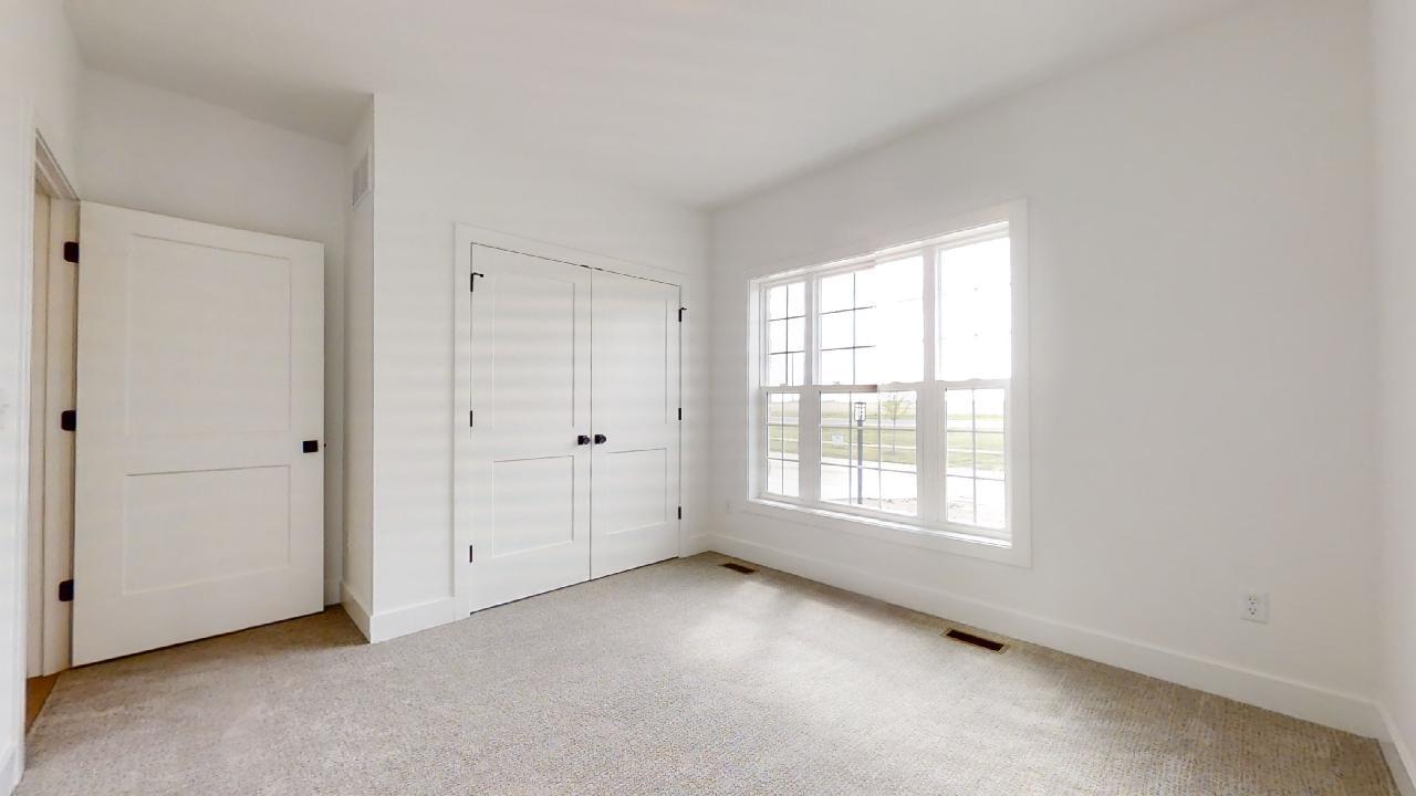 3910 Bay Circle Champaign, IL 61822 - Photo 23 of 49 an empty room with windows