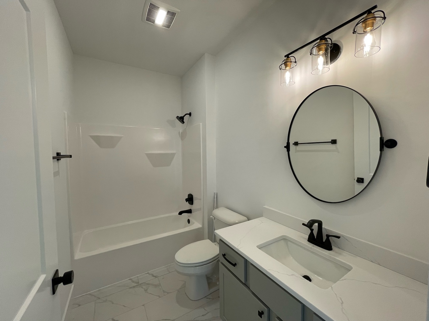 3910 Bay Circle Champaign, IL 61822 - Photo 30 of 49 a bathroom with a sink a toilet and a mirror