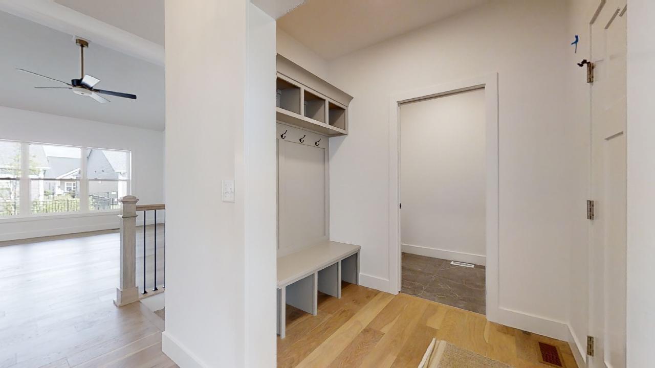3910 Bay Circle Champaign, IL 61822 - Photo 31 of 49 a view of a hallway with wooden floor and staircase