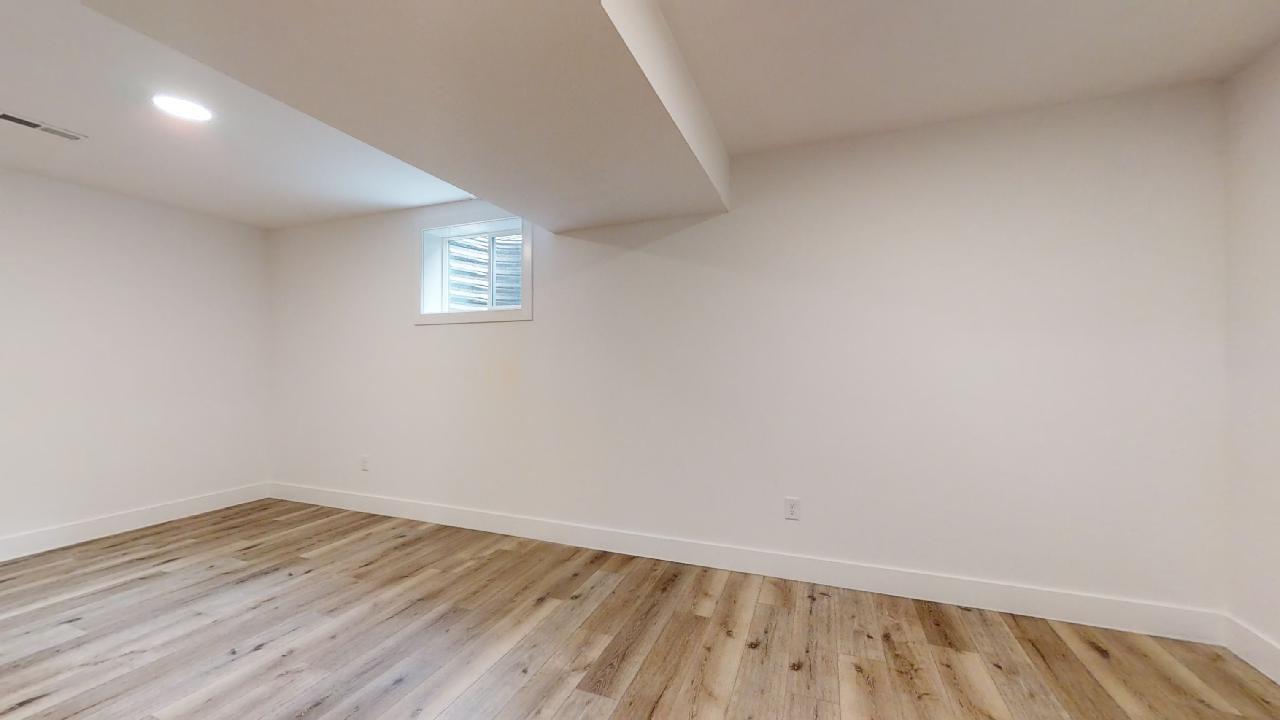 3910 Bay Circle Champaign, IL 61822 - Photo 33 of 49 a view of an empty room with wooden floor and a window