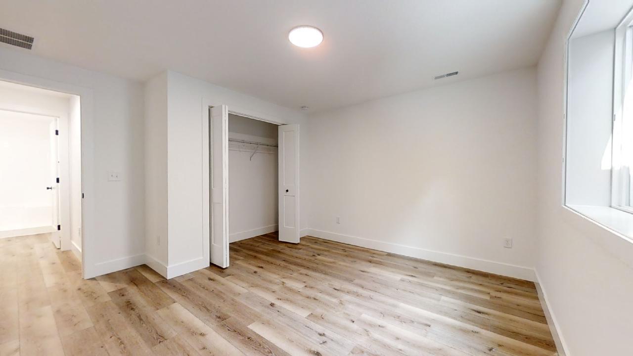 3910 Bay Circle Champaign, IL 61822 - Photo 40 of 49 an empty room with wooden floor and windows