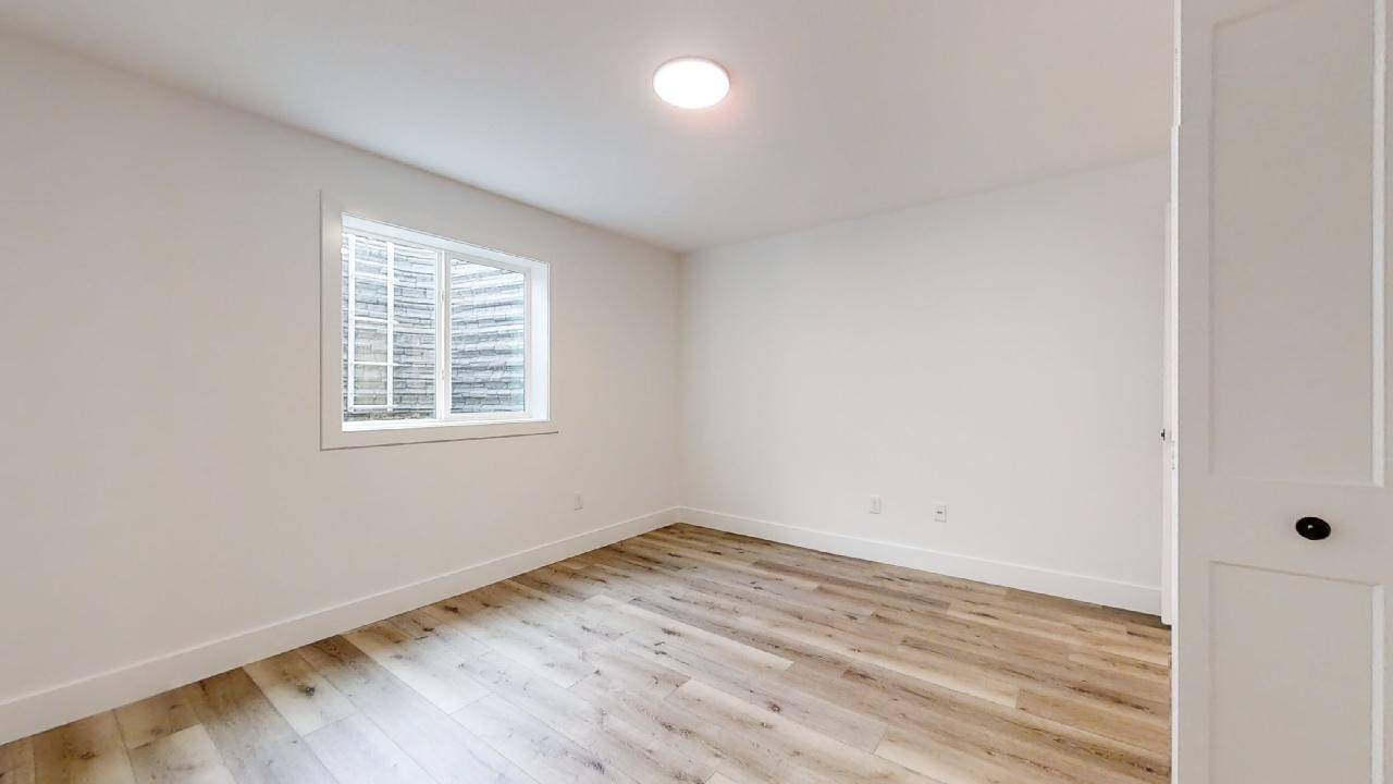 3910 Bay Circle Champaign, IL 61822 - Photo 42 of 49 an empty room with wooden floor and windows