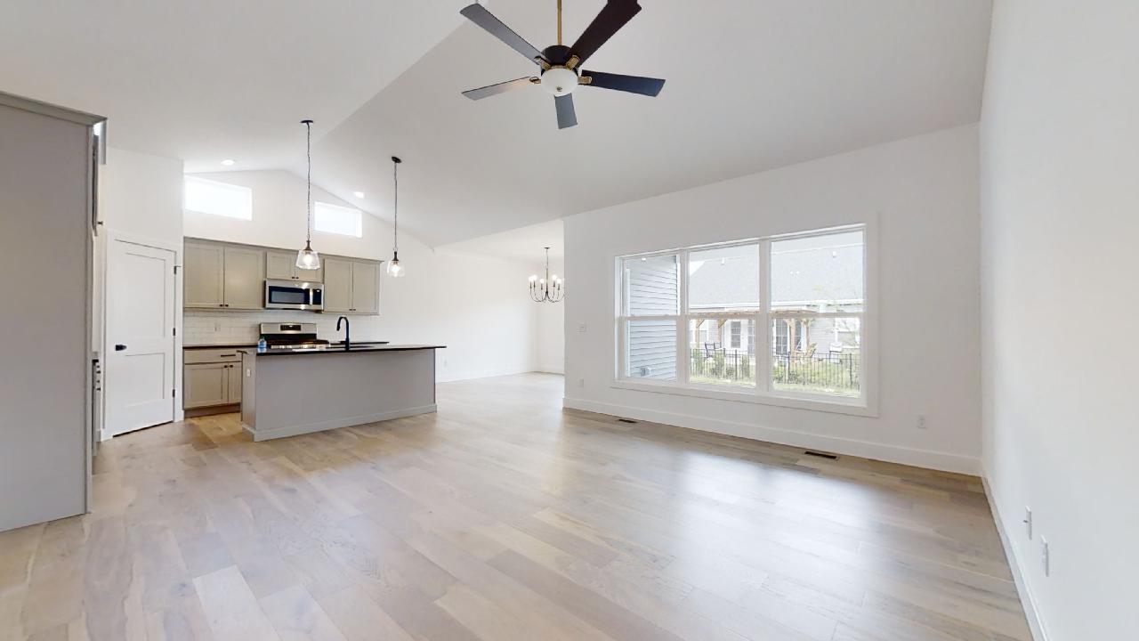 3910 Bay Circle Champaign, IL 61822 - Photo 5 of 49 a large kitchen with cabinets wooden floor and a dining table