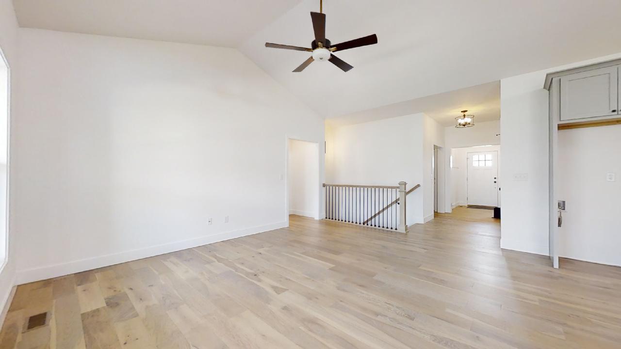 3910 Bay Circle Champaign, IL 61822 - Photo 7 of 49 a view of a livingroom with a hardwood floor and a ceiling fan
