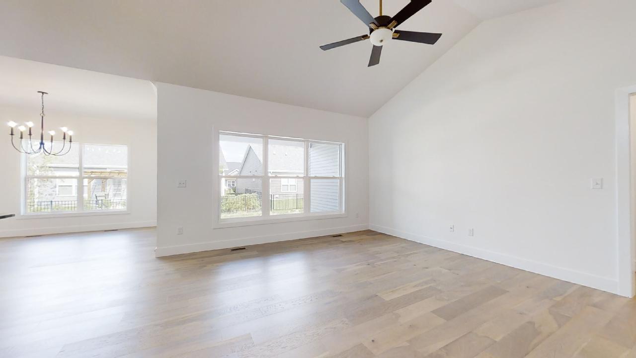 3910 Bay Circle Champaign, IL 61822 - Photo 8 of 49 a view of an empty room with a window and wooden floor