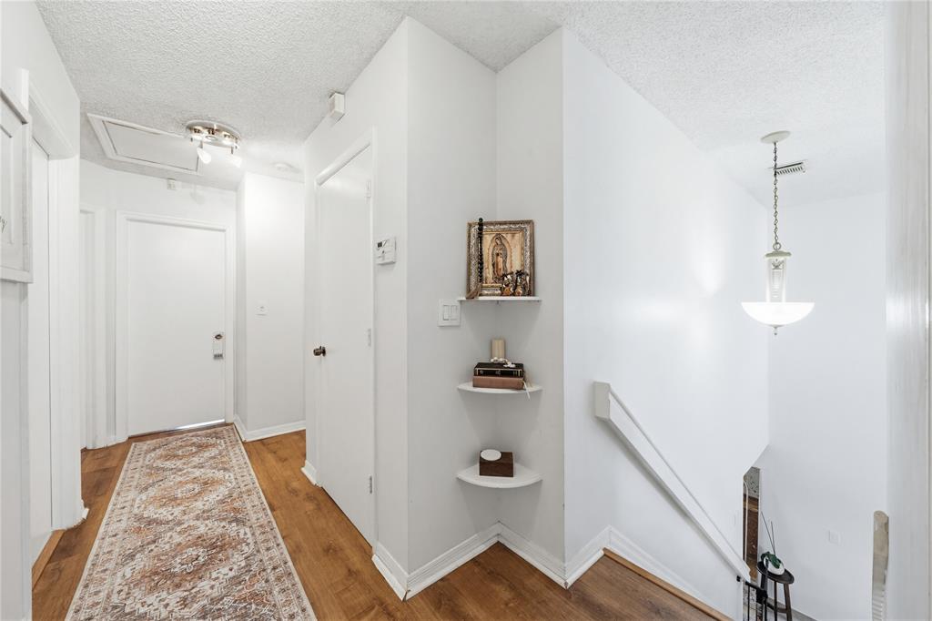 14277 Southwest 177th Street Miami, FL 33177 - Photo 19 of 38 a view of a hallway with wooden floor and staircase