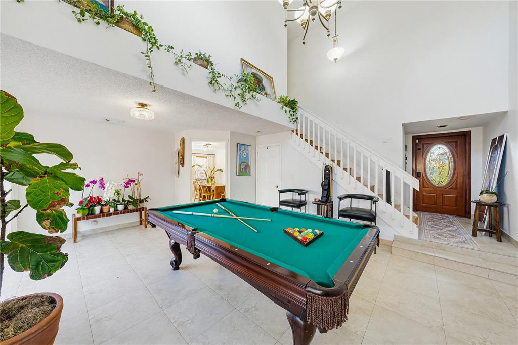 14277 Southwest 177th Street Miami, FL 33177 - Photo 7 of 38 a room with pool table table soccer and potted plants