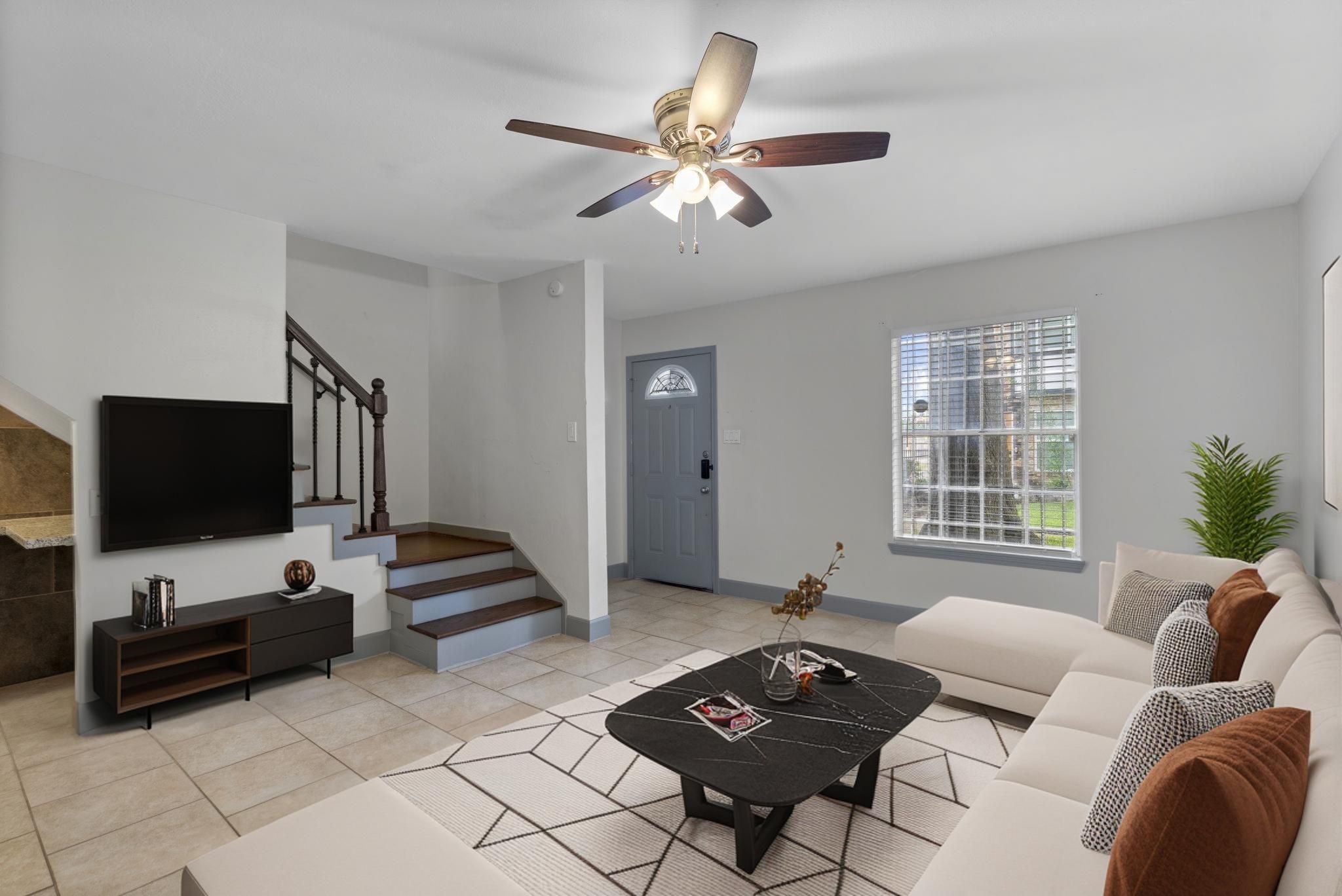 1271 Witte Road, Unit 26 Houston, TX 77055 - Photo 2 of 27 a living room with furniture and a flat screen tv