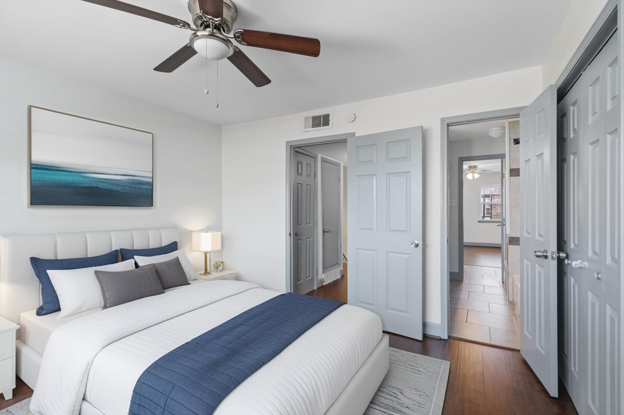 1271 Witte Road, Unit 26 Houston, TX 77055 - Photo 22 of 27 a bedroom with a bed and a chandelier