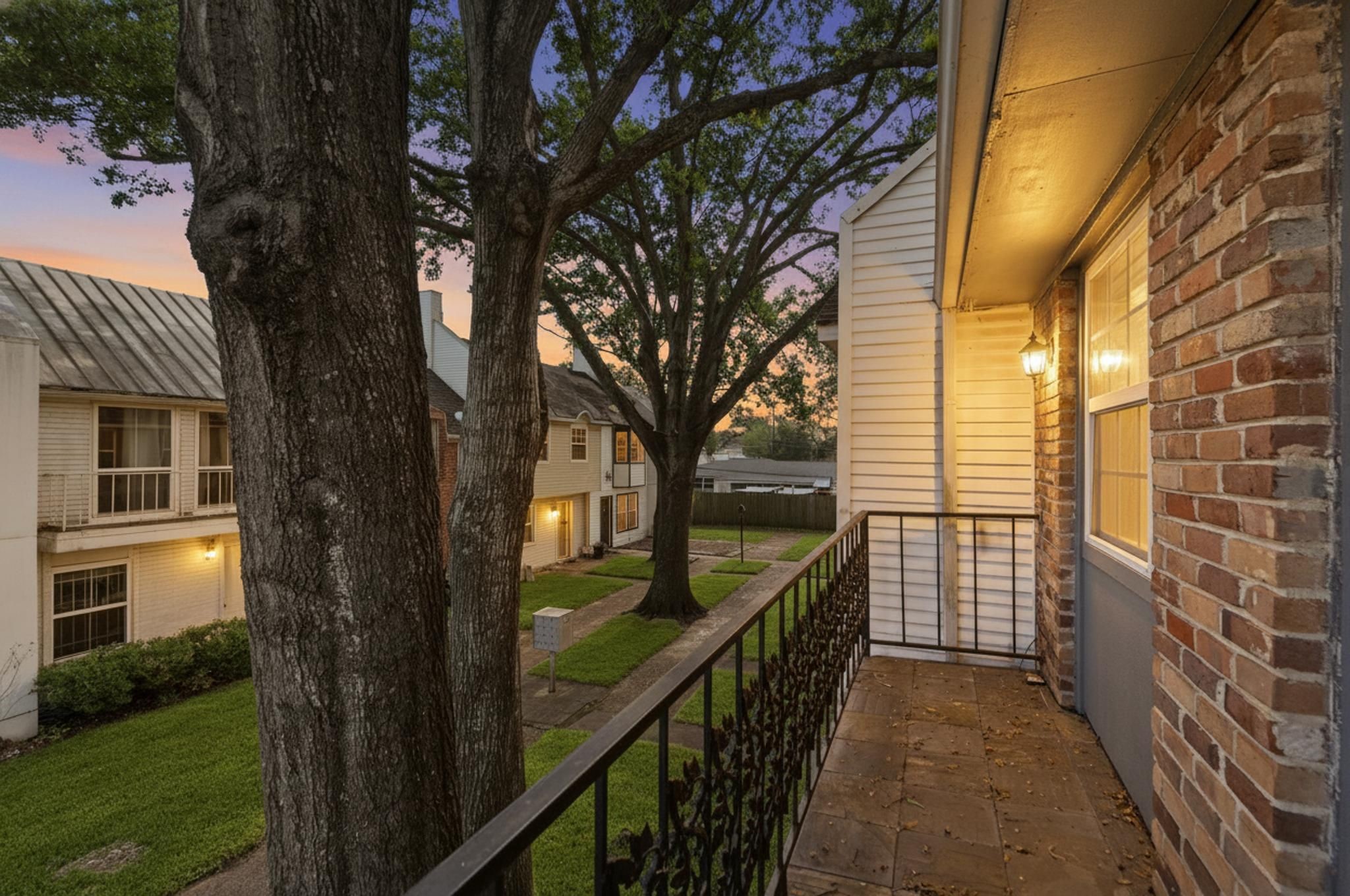 1271 Witte Road, Unit 26 Houston, TX 77055 - Photo 25 of 27 a view of balcony with wooden floor and fence